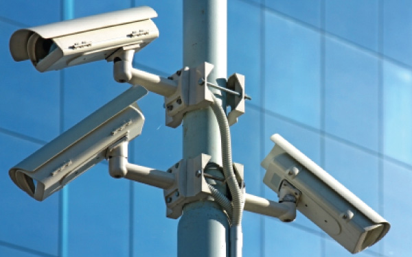 Security cameras stationed outdoors.